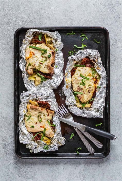 pork-chops-and-sun-dried-tomato-foil-packets image