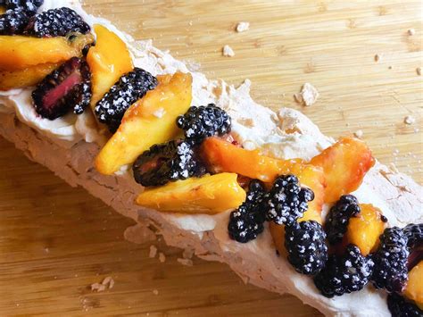 showstopper-rolled-pavlova-with-peaches-and-blackberries image