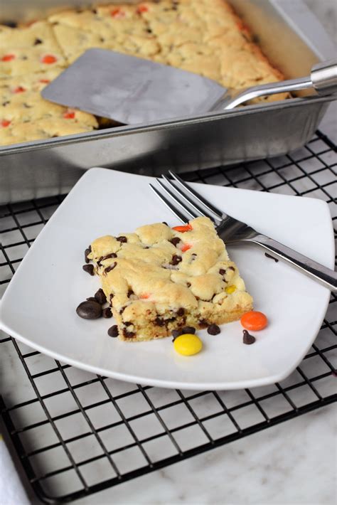 reeses-pieces-cake-mix-cookie-bars-snacks-and-sips image