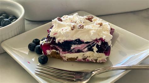 luscious-layered-blueberry-delight-recipe-mashed image