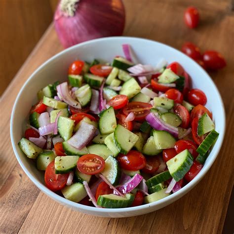 cucumber-tomato-onion-salad-pesto-and-potatoes image