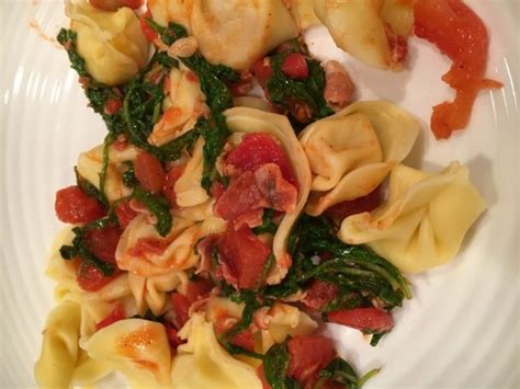 ravioli-with-arugula-tomatoes-and-pancetta-arugula image