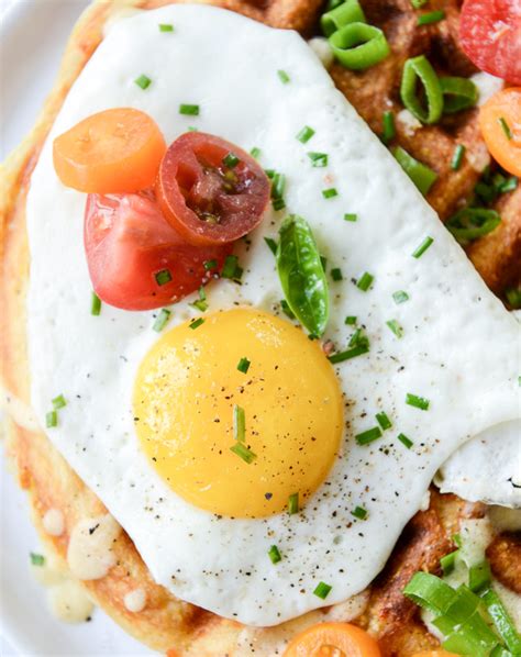 cheddar-cornbread-waffles-with-fried-eggs-and-queso image