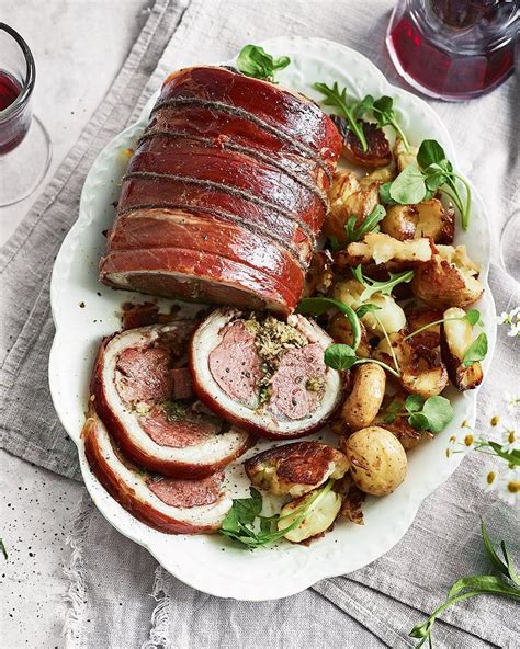 herby-stuffed-saddle-of-lamb-with-crushed-roasties image