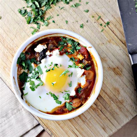 poached-eggs-in-tomato-sauce-with-chickpeas-feta image