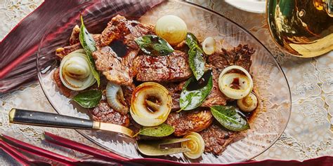 filipino-style-beef-steak-with-onion-and-bay-leaves image