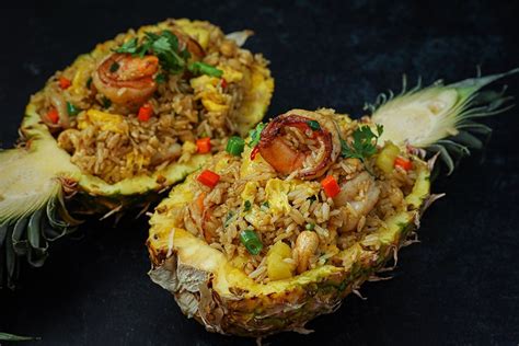 the-best-pineapple-fried-rice-on-a-pineapple-bowl image