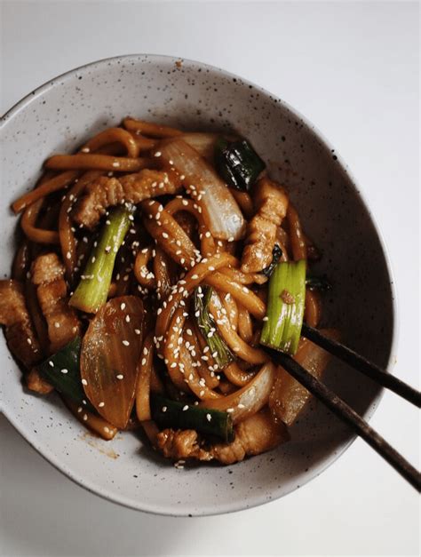 30-minute-fried-udon-noodles-pork-stir-fry-couple image