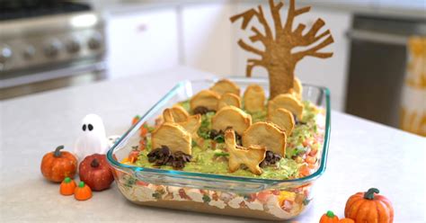 make-a-ghoulish-guacamole-graveyard-with-tombstone image