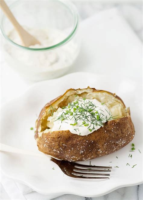 baked-potatoes-with-garlic-herb-sour-cream image