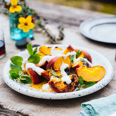 grilled-peaches-with-honey-mascarpone-eatingwell image