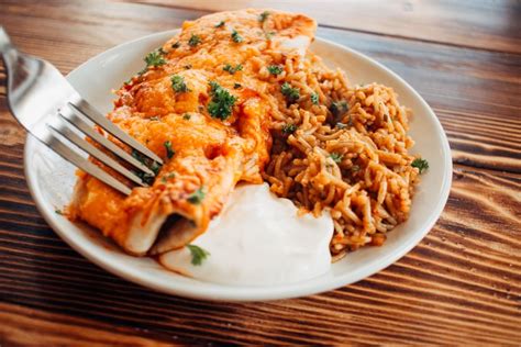 cheesy-chicken-and-black-bean-enchiladas-thriving-home image