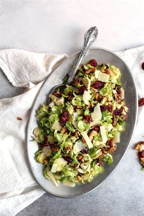 shredded-brussels-sprouts-salad-with-cranberries-walnuts image