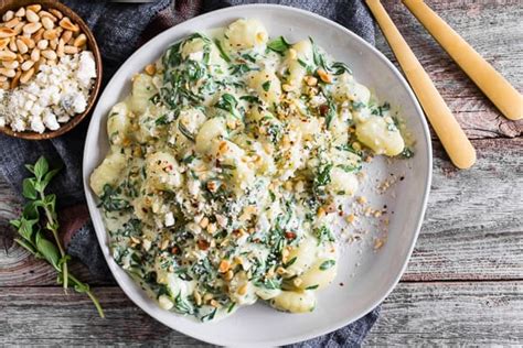 creamy-gorgonzola-gnocchi-with-spinach-and-pine-nuts image