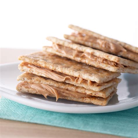crackers-with-peanut-butter-eatingwell image