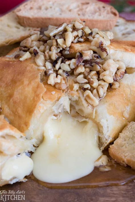 baked-brie-with-walnuts-and-honey-in-a-puff-pastry-this image