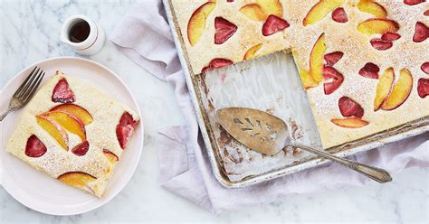 baked-pancakes-with-peaches-and-strawberries-recipe-purewow image