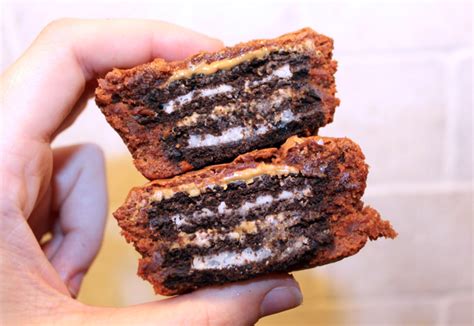 peanut-butter-and-oreo-stuffed-brownie-cupcakes image