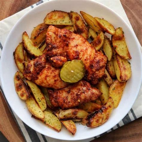 spicy-baked-chicken-thighs-and-ranch-potatoes image