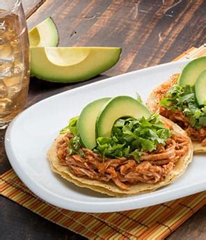 chicken-tinga-and-avocado-tostadas-avocados-from-mexico image