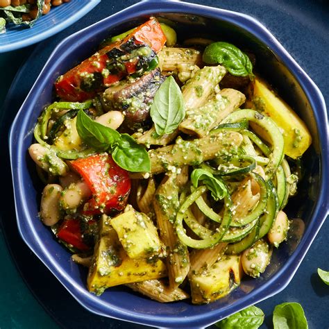 basil-pesto-pasta-with-grilled-vegetables-eatingwell image