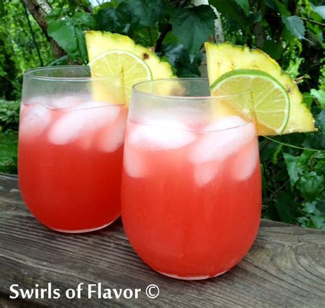 caribbean-sunset-rum-cocktail-swirls-of-flavor image