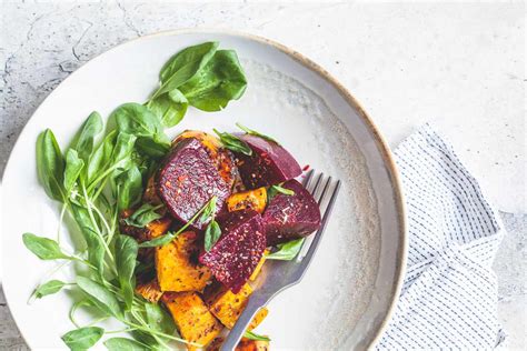roasted-sweet-potatoes-and-beets-recipe-the-spruce image