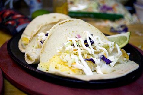 fish-tacos-with-spicy-sour-cream image