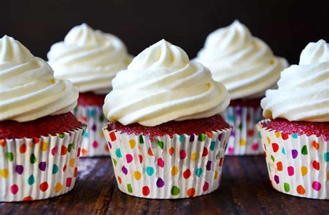 red-velvet-cupcakes-with-piped-cream-cheese-frosting image