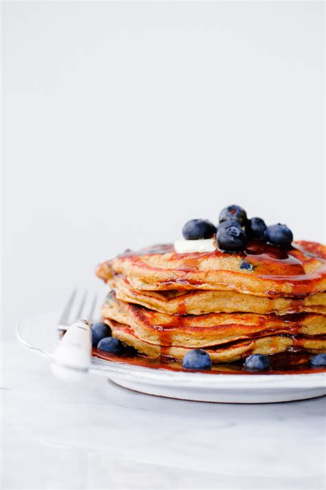 blueberry-rye-pancakes-with-molasses-syrup-a-beautiful image