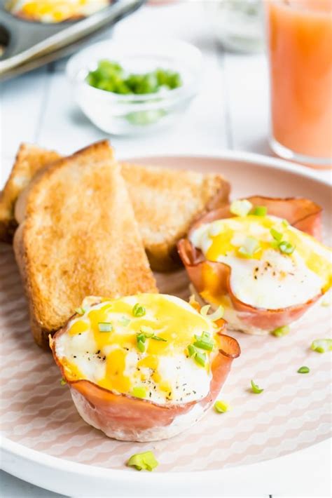 baked-ham-and-cheese-egg-cups-the-delicious-spoon image
