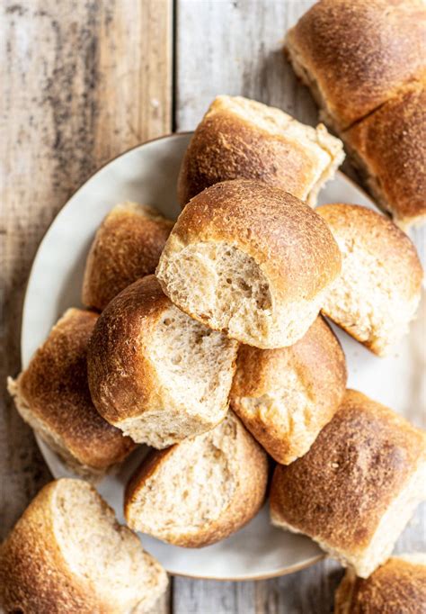 fluffy-whole-wheat-dinner-rolls-baking-with-butter image