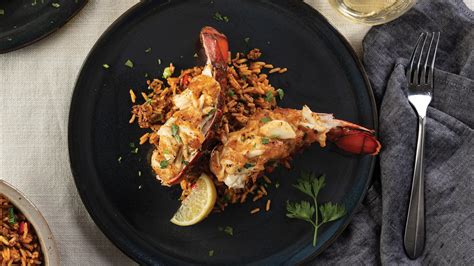 crab-stuffed-lobster-tails-with-dirty-rice-recipe-omaha image