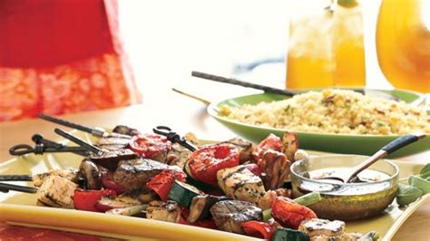 surf-n-turf-kebabs-with-cilantro-lime-sauce-bon-appetit image