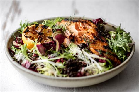 grilled-salmon-over-lentil-salad-with-charred-meyer image