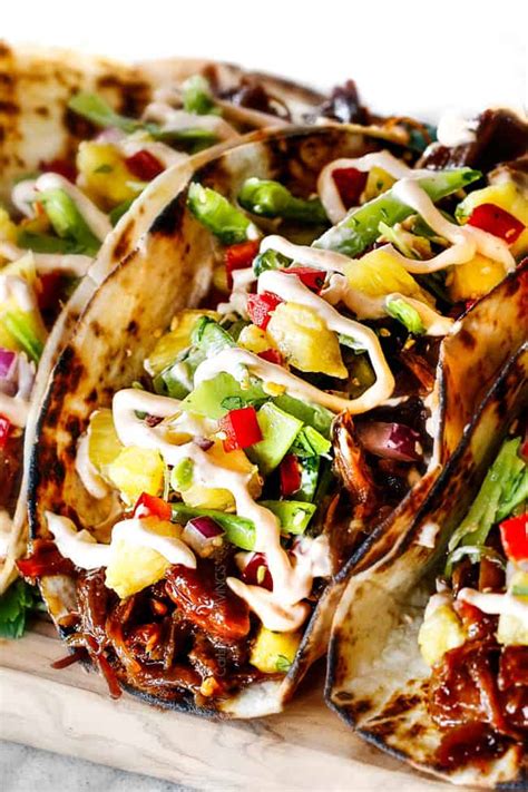 asian-pulled-pork-tacos-with-pineapple-snow-pea-salsa image