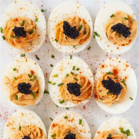 devilled-eggs-with-caviar-little-sugar-snaps image