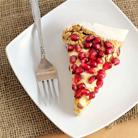greek-yogurt-cheesecake-with-pomegranate-syrup image