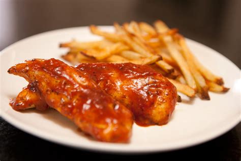barbeque-glazed-chicken-tenders-and-oven-fries image