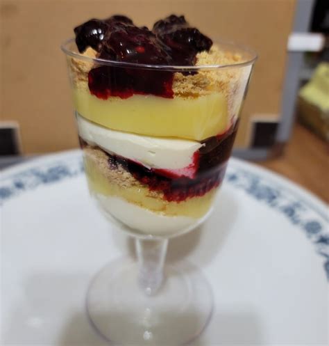 cheesecake-parfait-with-lemon-curd-and-blackberry image