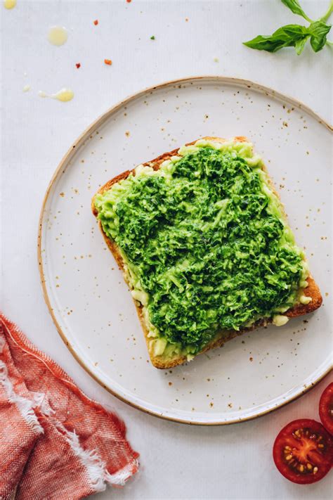 pesto-avocado-toast-with-fresh-tomatoes-minimalist image