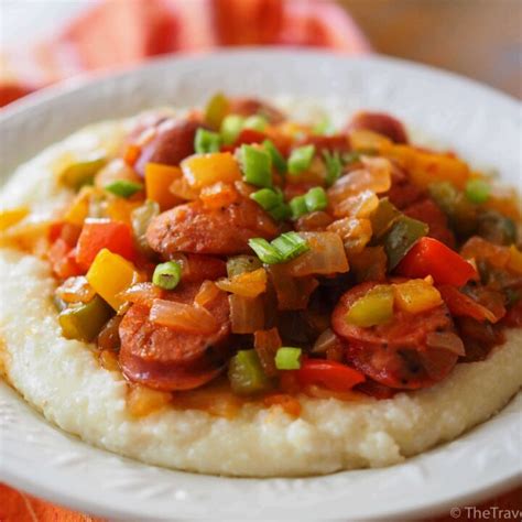 andouille-sausage-with-cheesy-grits-the-travel-bite image