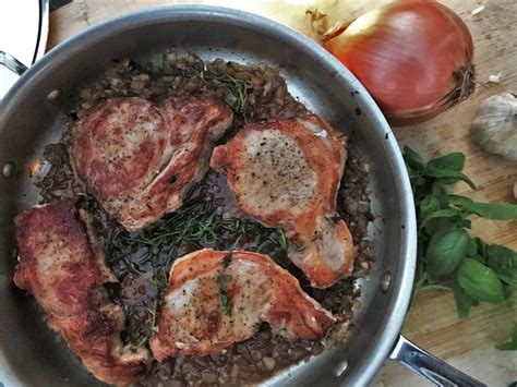 pan-braised-pork-chops-with-herb-wine-sauce image