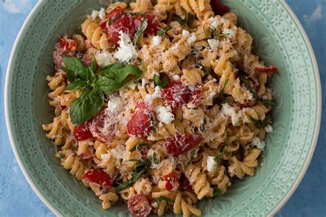 pasta-with-goat-cheese-tomatoes-and-crispy-garlic image