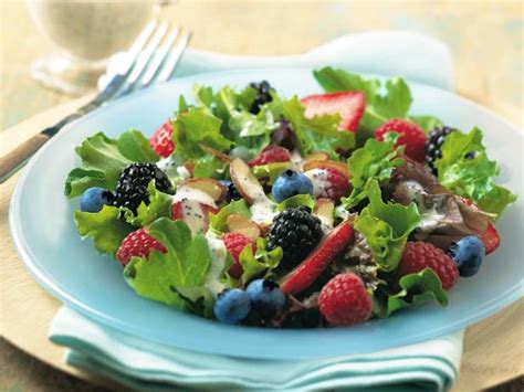 baby-greens-and-berry-salad-recipe-food-network image