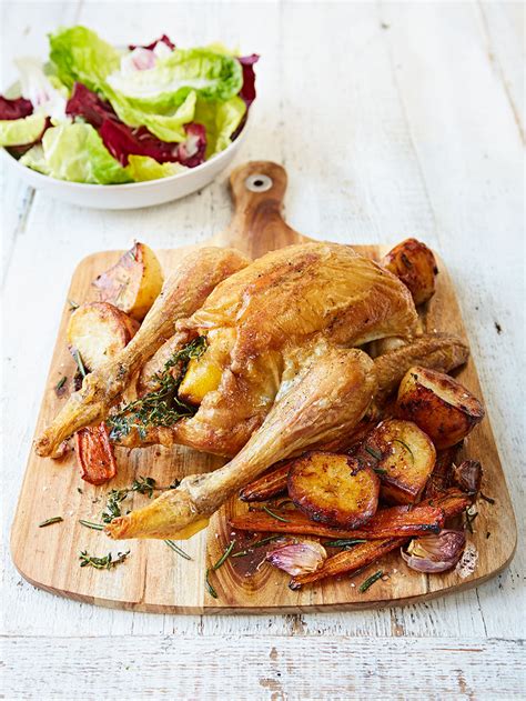 roast-chicken-with-potatoes-carrots-jamie-oliver image