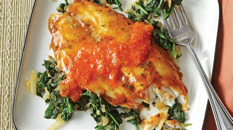 mediterranean-style-tilapia-with-sauted-spinach image