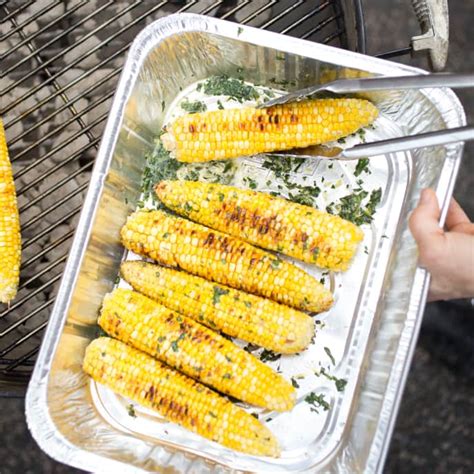 grilled-corn-with-flavored-butter-americas-test-kitchen image