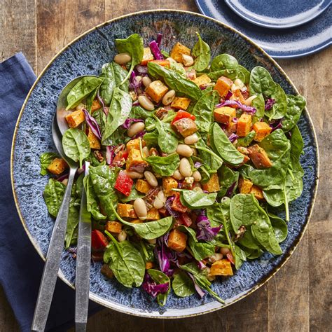 spinach-salad-with-roasted-sweet-potatoes-white-beans image