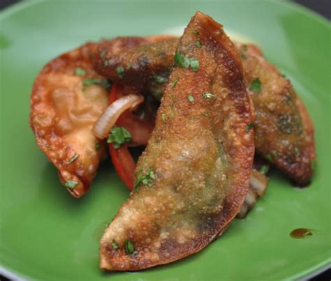 pork-dumplings-with-soy-chile-and-cilantro-sauce image